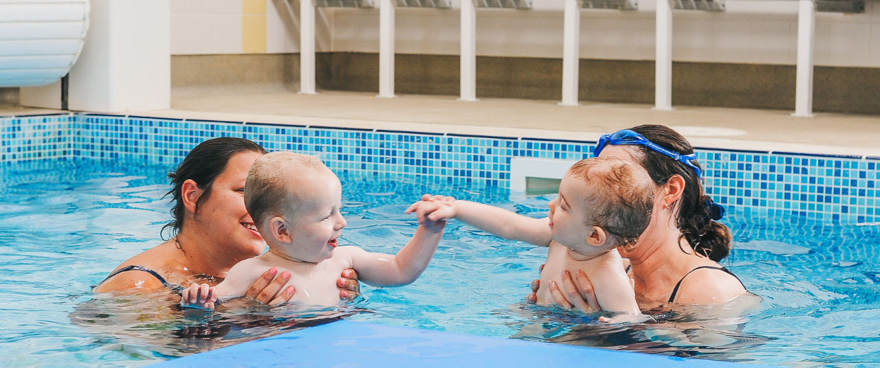 water babies playing in the swimming pool